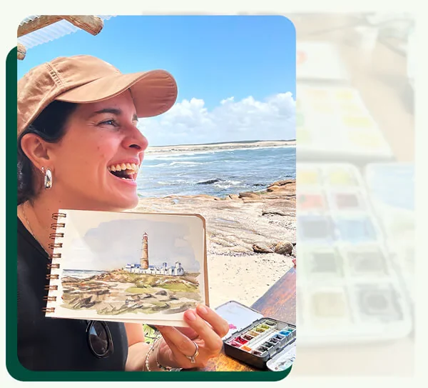 Carolina mostrando uma pintura em aquarela feita na praia